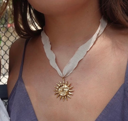 White Ribbon Sun Face Pendant Necklace